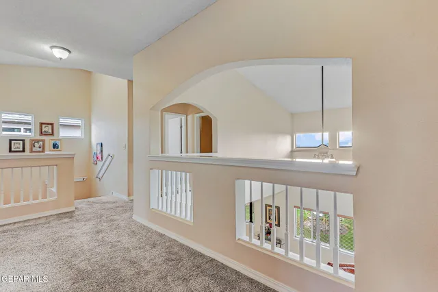 a view of a hallway with windows