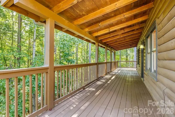 a view of balcony with wooden floor