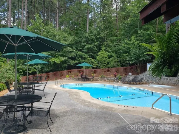 a view of a swimming pool with a patio