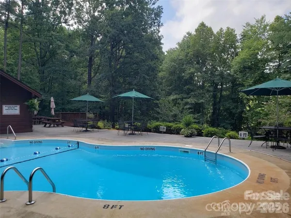 a view of a swimming pool with a patio