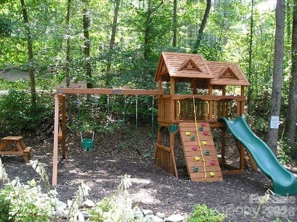 a view of a wooden deck with a yard