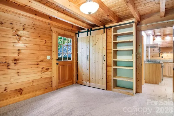 a view of an empty room and wooden floor