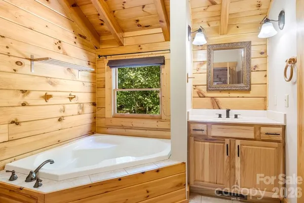 a bathroom with a bathtub and shower