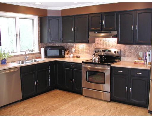 856 Burts Pit Road Northampton, MA 01062 - Photo 19 of 22 a kitchen with a sink a stove and cabinets