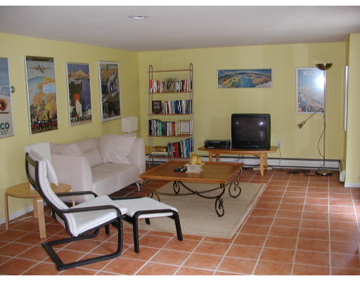 856 Burts Pit Road Northampton, MA 01062 - Photo 10 of 22 a living room with patio furniture and a flat screen tv