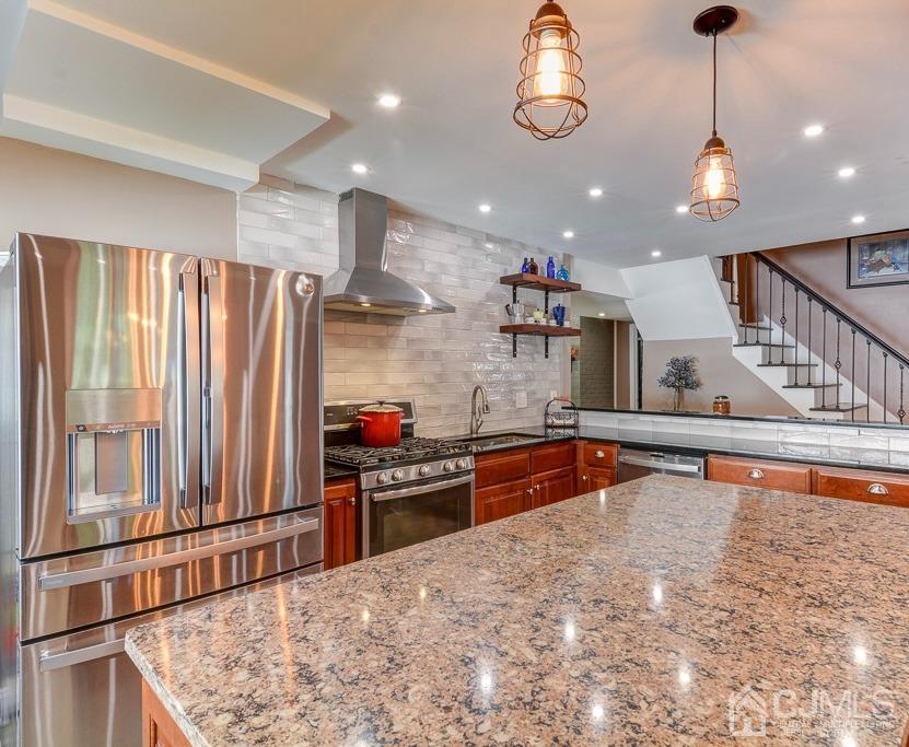 37 Morganville Road Matawan, NJ 07747 - Photo 20 of 31 a kitchen with stainless steel appliances granite countertop a sink and a refrigerator