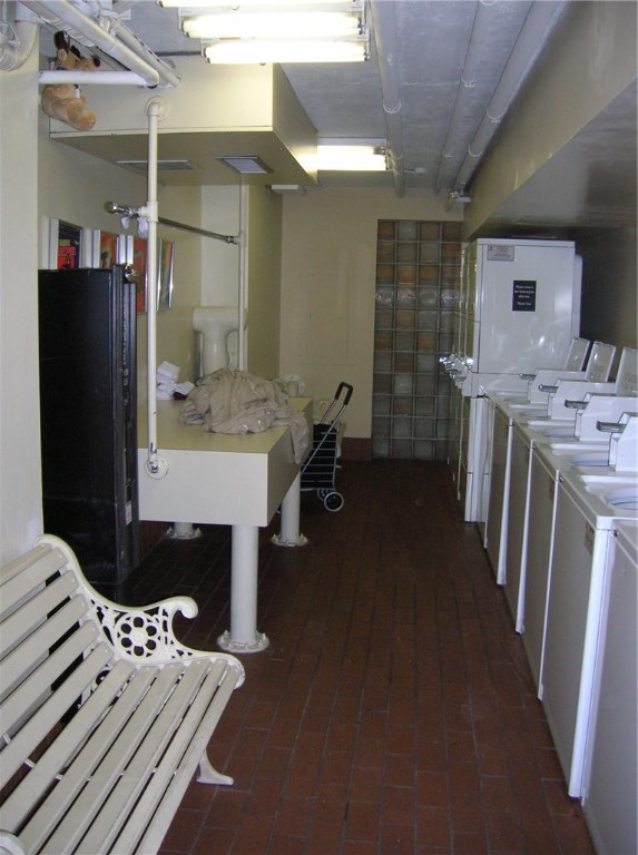 1122 Colorado Street, Unit 1101 Austin, TX 78701 - Photo 13 of 17 a bathroom with a sink a toilet and shower