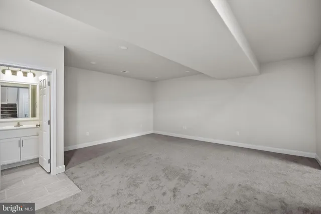 a view of an empty room and stairs