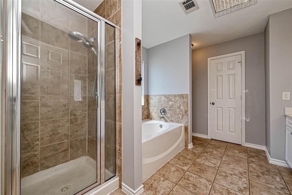 2419 Fox Water Drive Spring, TX 77386 - Photo 17 of 19 a bathroom with a tub shower and sink