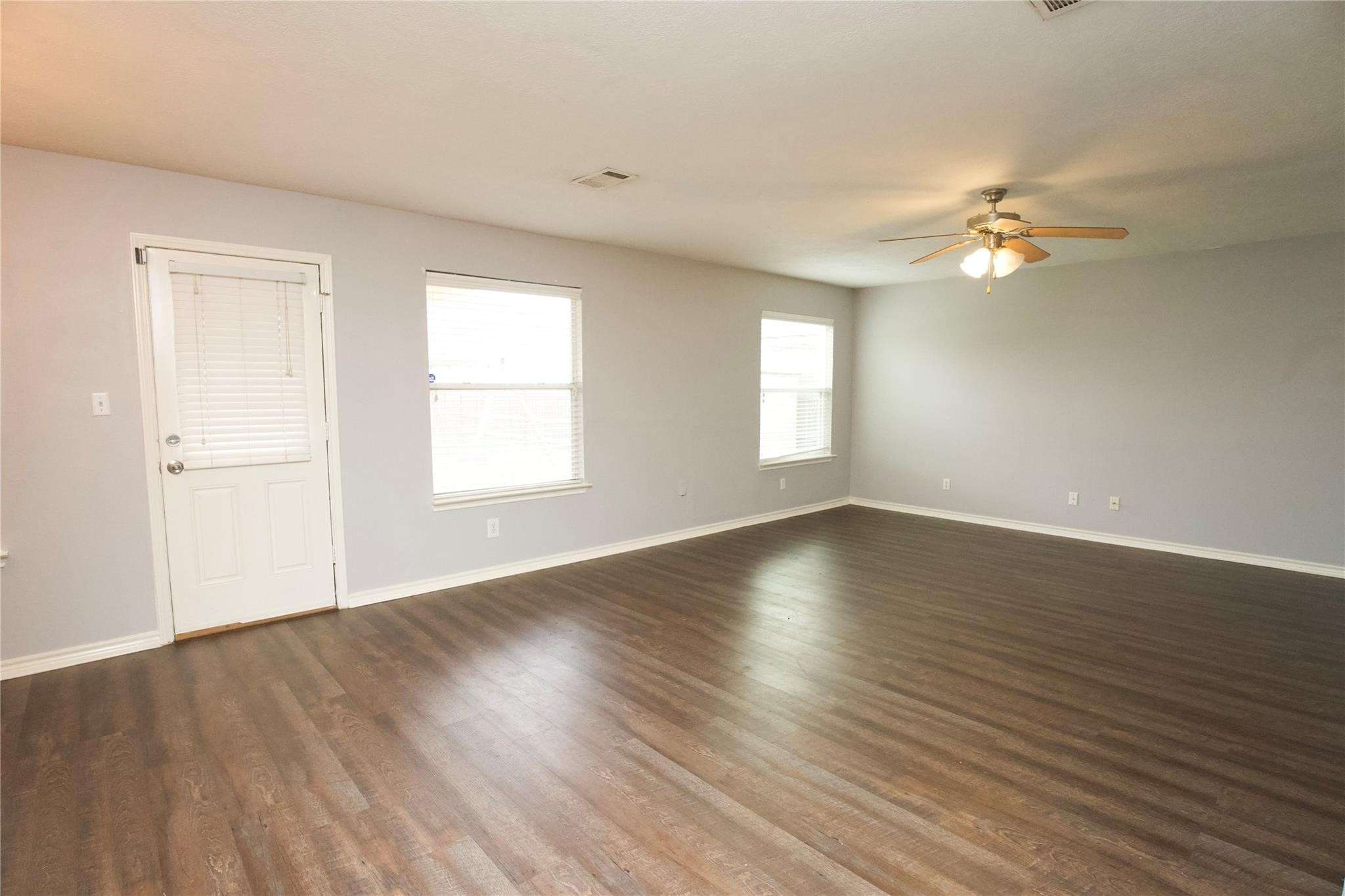 2419 Fox Water Drive Spring, TX 77386 - Photo 8 of 19 a view of empty room with wooden floor and fan