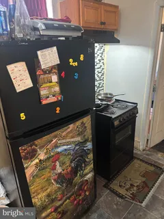 a kitchen with sink a microwave and cabinets