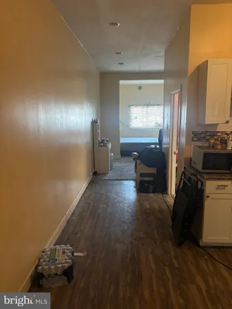 a view of a hallway with a door