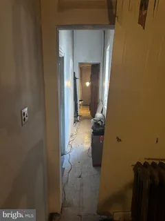 a bathroom with shower and a mirror