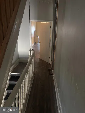 a bedroom with a bed and a desk