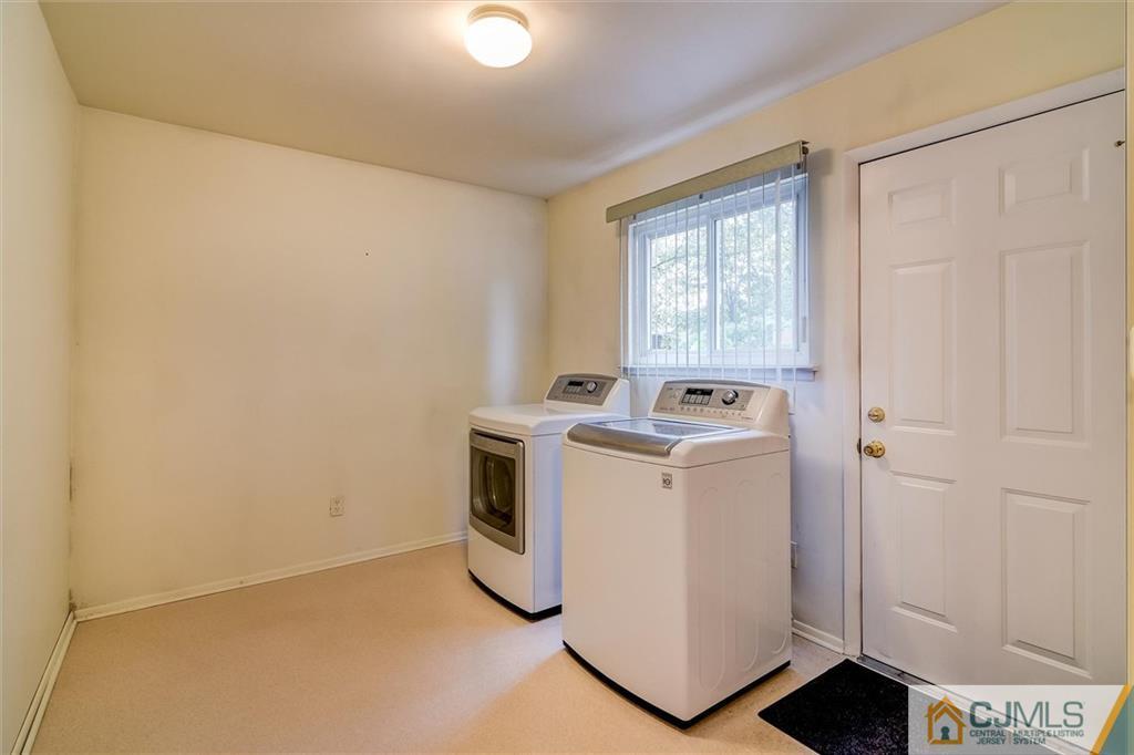 7 Arden Road Old Bridge, NJ 08857 - Photo 16 of 18 a view of washer and dryer with bathroom in the background