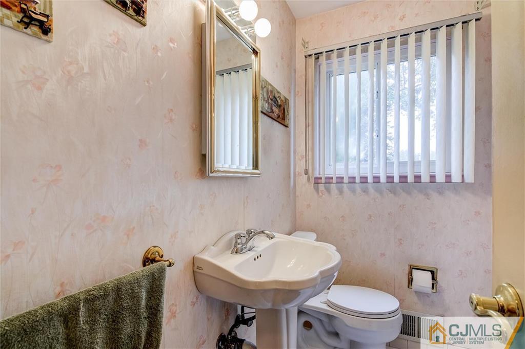7 Arden Road Old Bridge, NJ 08857 - Photo 17 of 18 a bathroom with a sink a toilet and a mirror