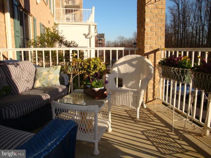 12021 Tralee Road, Unit 201 Lutherville-Timonium, MD 21093 - Photo 18 of 30 a view of a balcony with chairs