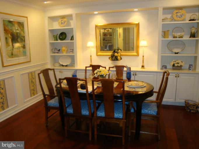 12021 Tralee Road, Unit 201 Lutherville-Timonium, MD 21093 - Photo 26 of 30 a view of a dining room with furniture and wooden floor