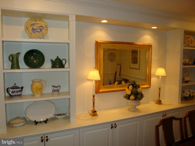 12021 Tralee Road, Unit 201 Lutherville-Timonium, MD 21093 - Photo 29 of 30 a room with a sink and a mirror