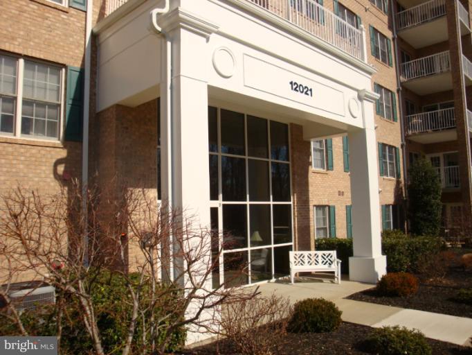 12021 Tralee Road, Unit 201 Lutherville-Timonium, MD 21093 - Photo 30 of 30 a view of a building with glass door and glass windows