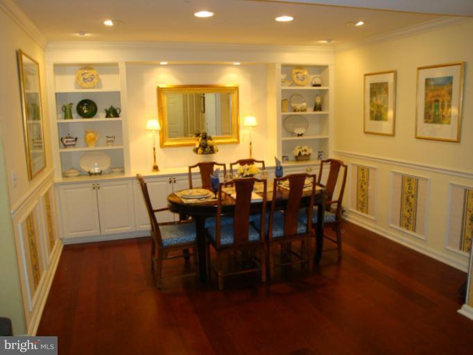 12021 Tralee Road, Unit 201 Lutherville-Timonium, MD 21093 - Photo 9 of 30 a view of a dining room with furniture and wooden floor