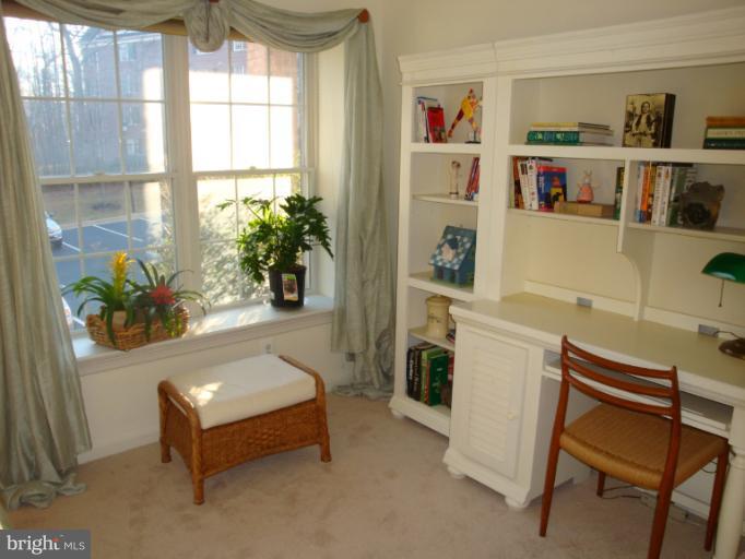 12021 Tralee Road, Unit 201 Lutherville-Timonium, MD 21093 - Photo 10 of 30 a living room with furniture and a window