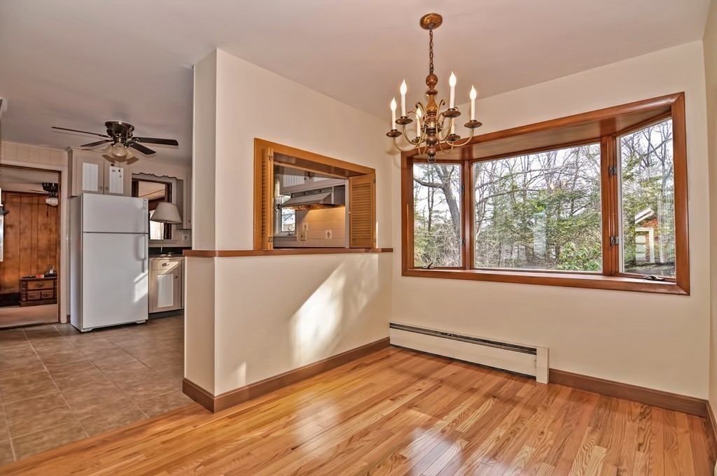 66 Old Post Road Walpole, MA 02032 - Photo 16 of 30 a view of a room with wooden floor chandelier and windows