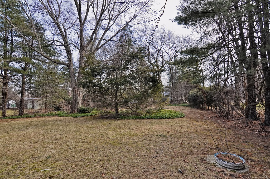 66 Old Post Road Walpole, MA 02032 - Photo 7 of 30 a backyard of a house with lots of green space