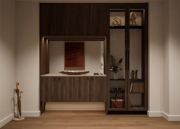 a view of an entryway with wooden floor