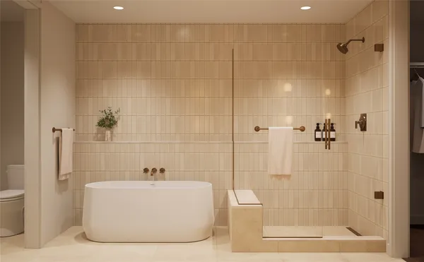 a white bath tub sitting next to a white sink