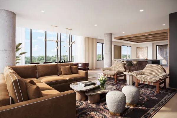 a living room with furniture and large windows