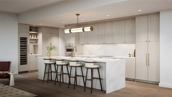 a kitchen that has a table chairs in it and wooden floors