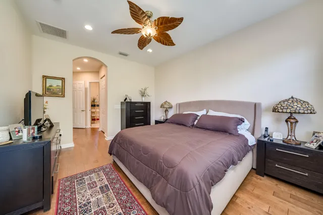 a bedroom with a bed and dresser