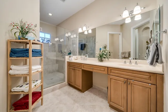 a bathroom with a double vanity sink and a mirror