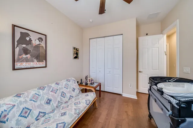 a bedroom with a bed and a dresser