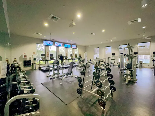 a swimming pool with outdoor seating and yard