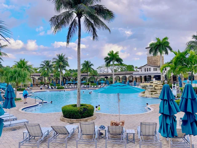 a view of a swimming pool with a yard