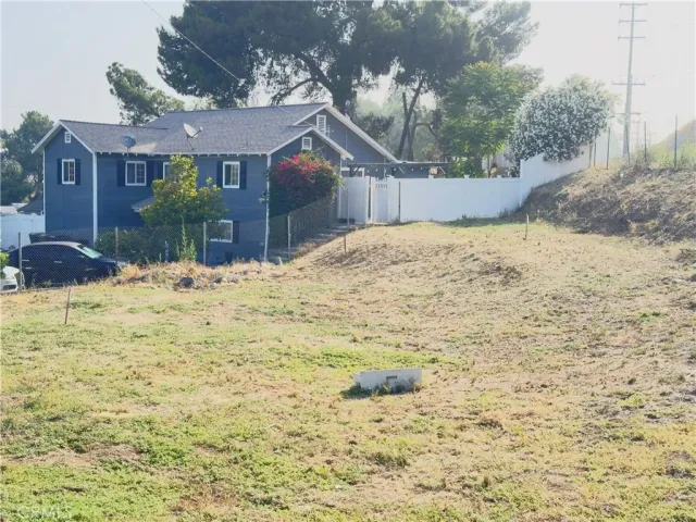 a view of a yard covered in snow