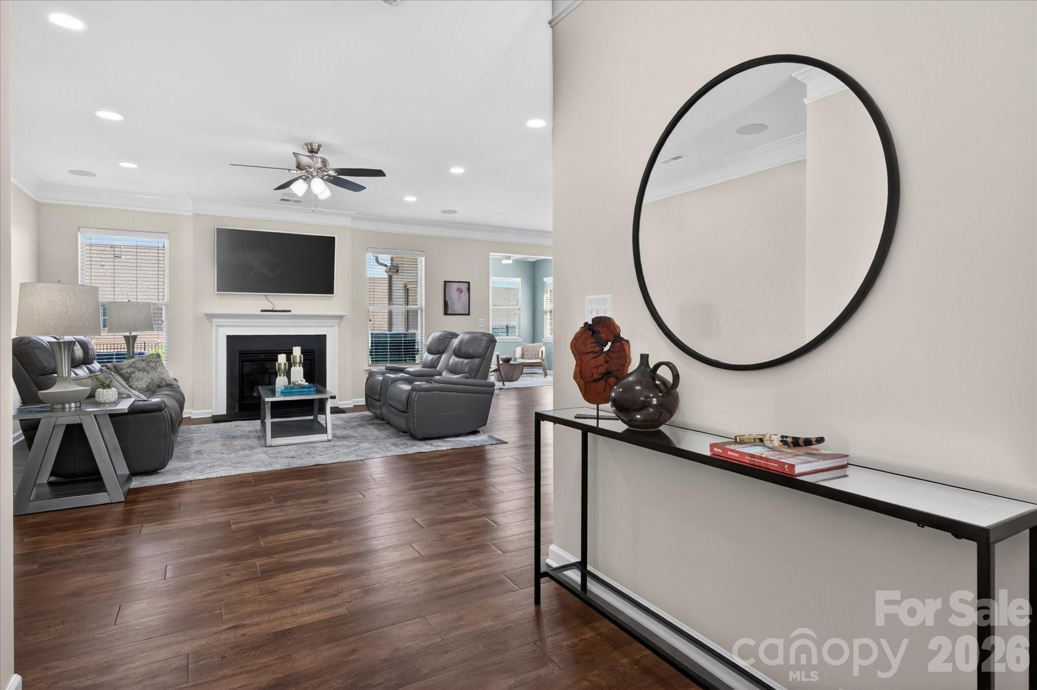 2032 Pinyon Lane Lancaster, SC 29720 - Photo 11 of 44 a living room with furniture a flat screen tv and a fireplace