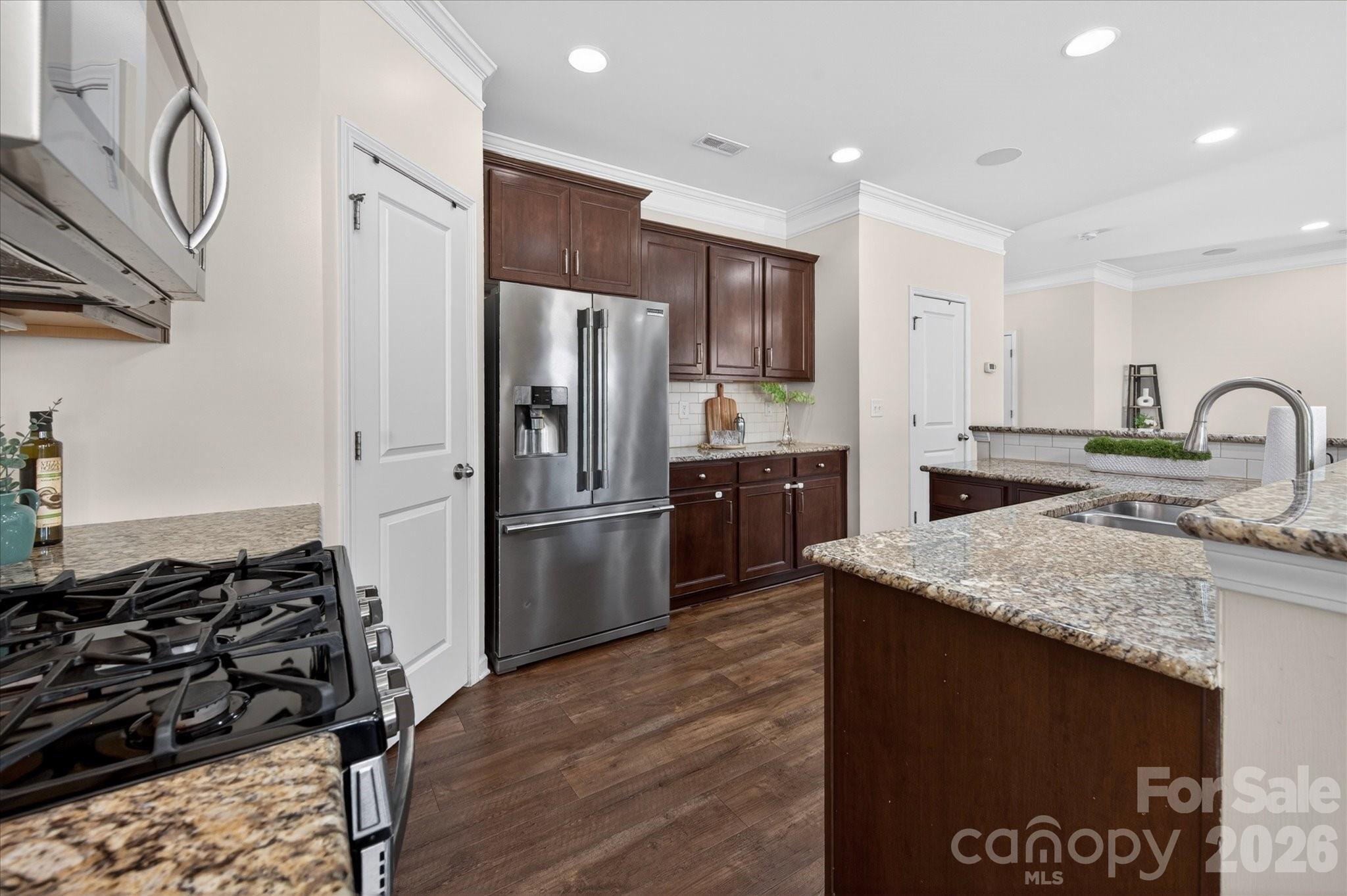 2032 Pinyon Lane Lancaster, SC 29720 - Photo 15 of 44 a kitchen with stainless steel appliances granite countertop a sink stove and refrigerator