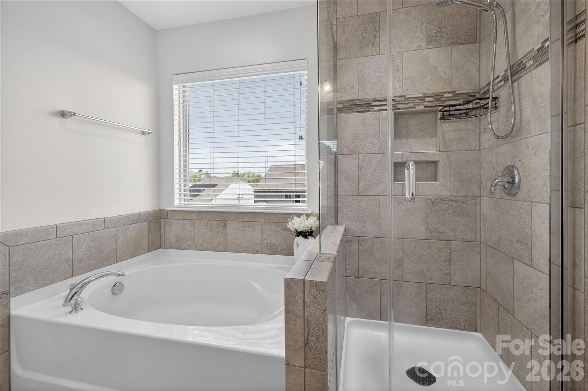 2032 Pinyon Lane Lancaster, SC 29720 - Photo 30 of 44 a bathroom with a bathtub and a shower