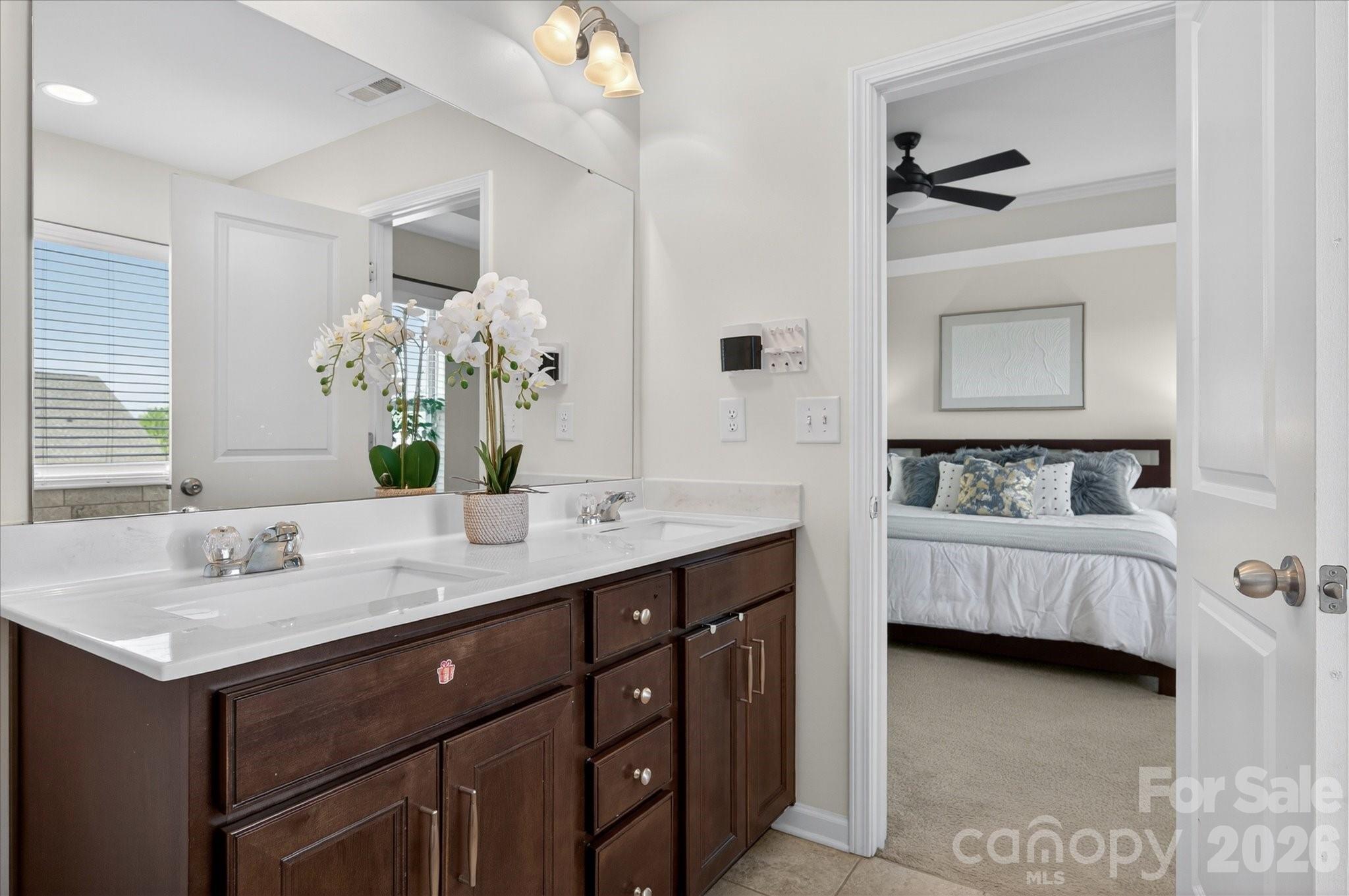 2032 Pinyon Lane Lancaster, SC 29720 - Photo 31 of 44 a bathroom with a double vanity sink mirror and