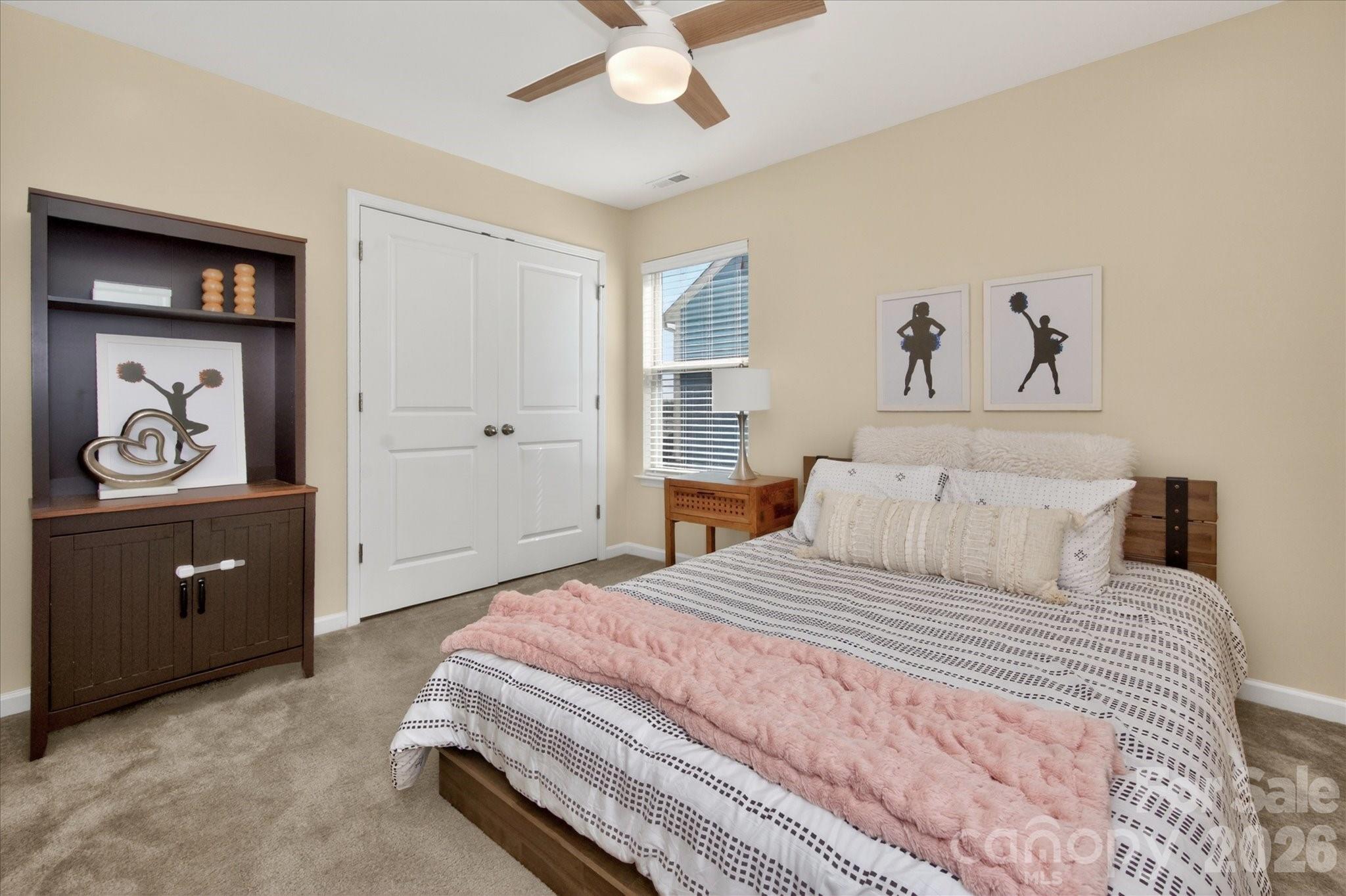 2032 Pinyon Lane Lancaster, SC 29720 - Photo 32 of 44 a bedroom with a bed and a chandelier