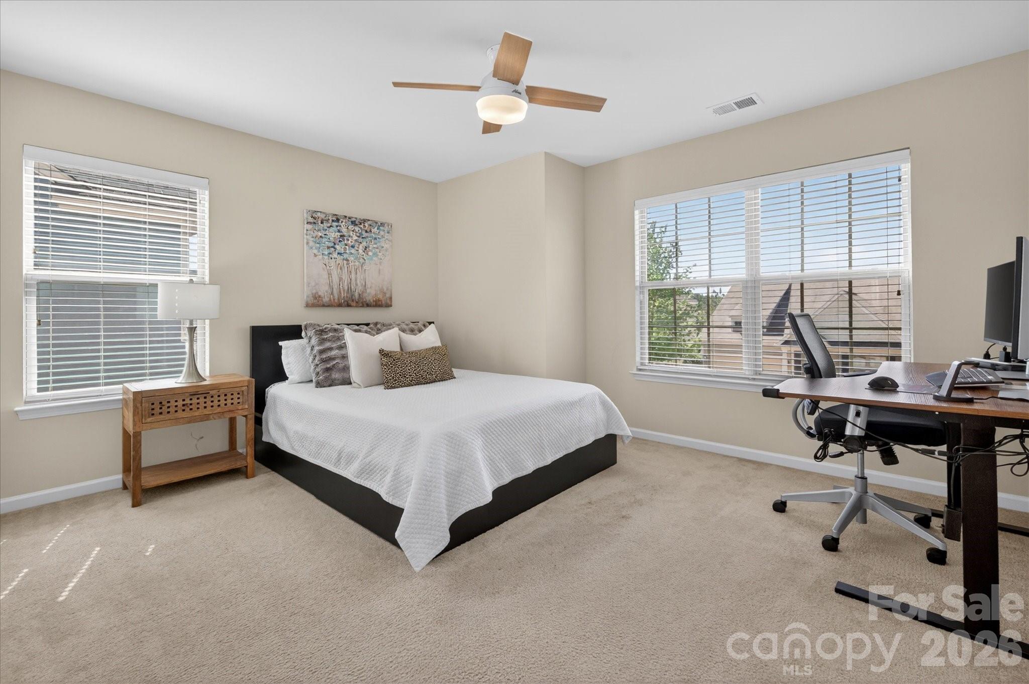 2032 Pinyon Lane Lancaster, SC 29720 - Photo 34 of 44 a bedroom with a bed a desk and a window