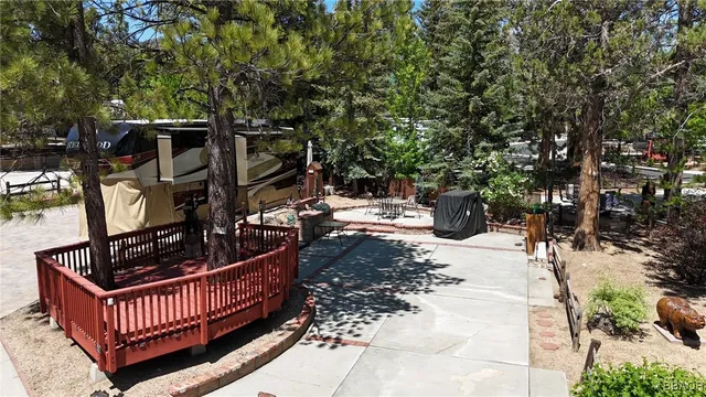 a view of porch with patio outdoor seating and covered with trees
