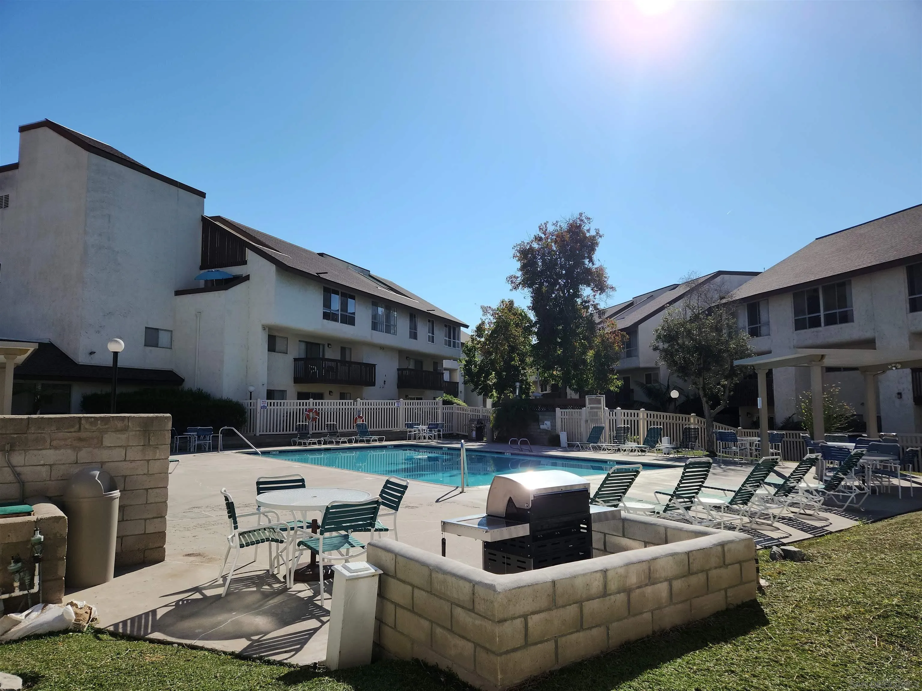 6171 Rancho Mission Road, Unit 101 San Diego, CA 92108 - Photo 7 of 10 a outdoor living space with furniture and a fireplace