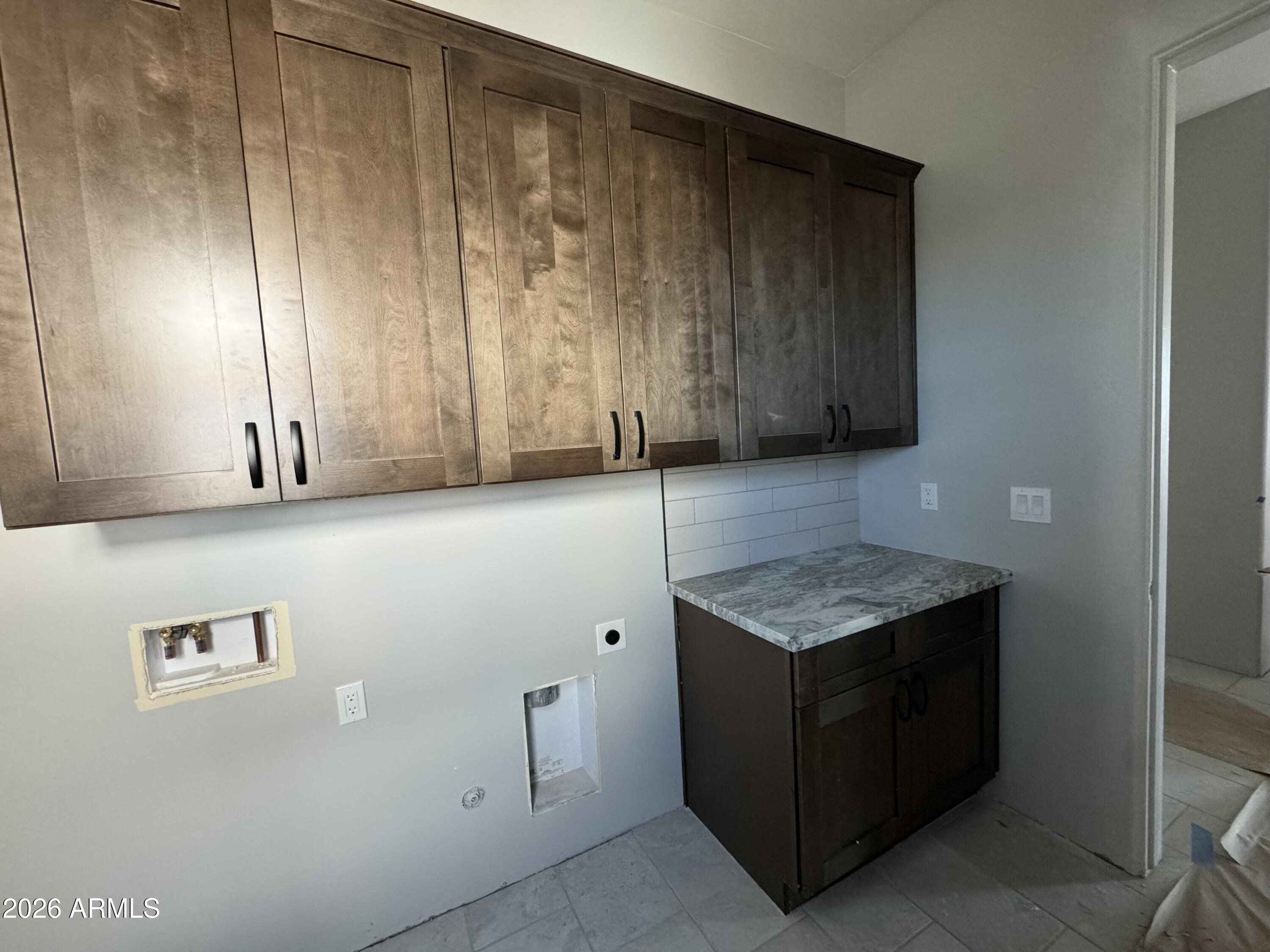 15728 West Montgomery Road Surprise, AZ 85387 - Photo 14 of 19 a kitchen with a cabinets and window