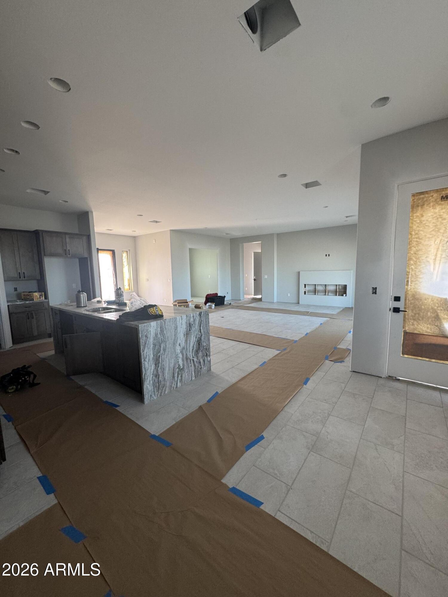 15728 West Montgomery Road Surprise, AZ 85387 - Photo 8 of 19 a living room with furniture and a chandelier