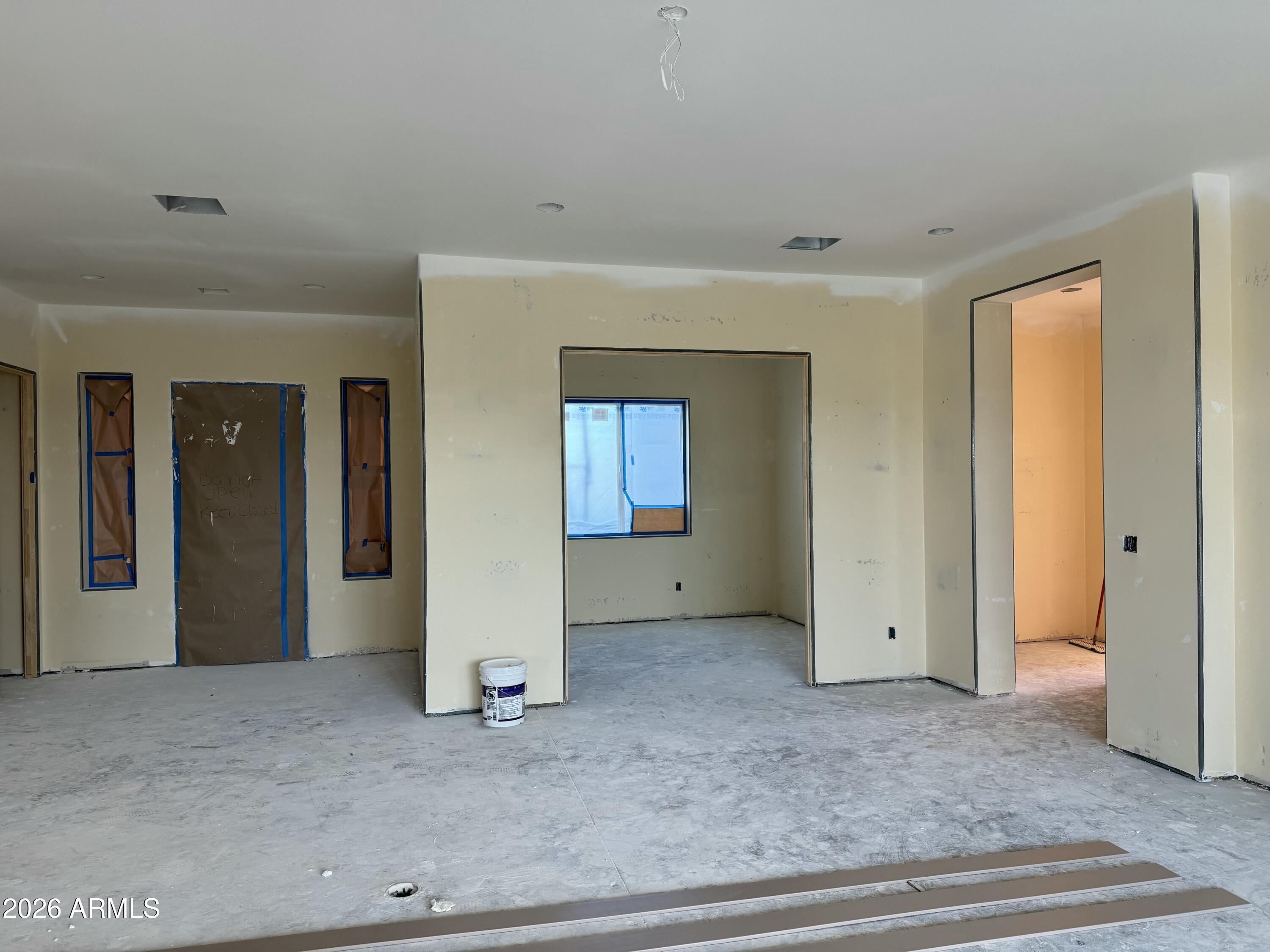 15728 West Montgomery Road Surprise, AZ 85387 - Photo 9 of 19 an empty room with closet and mirror