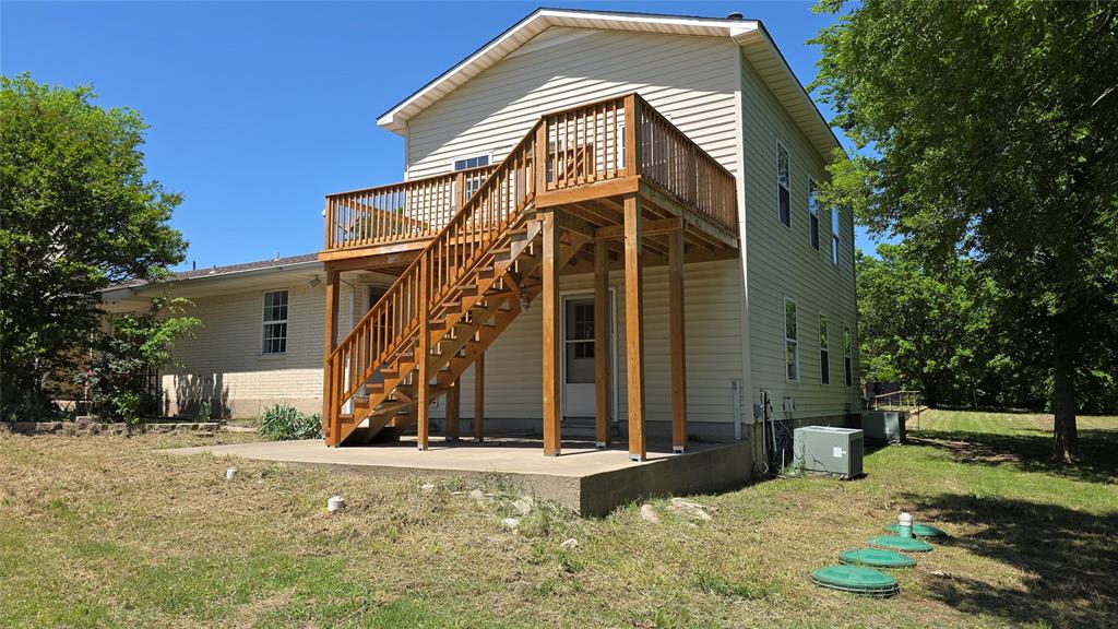 2474 Joe Davis Road Whitewright, TX 75491 - Photo 2 of 12 Multi-level wood deck with stairs providing ground access